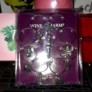 Gorgeous pewter wine charms. New in box